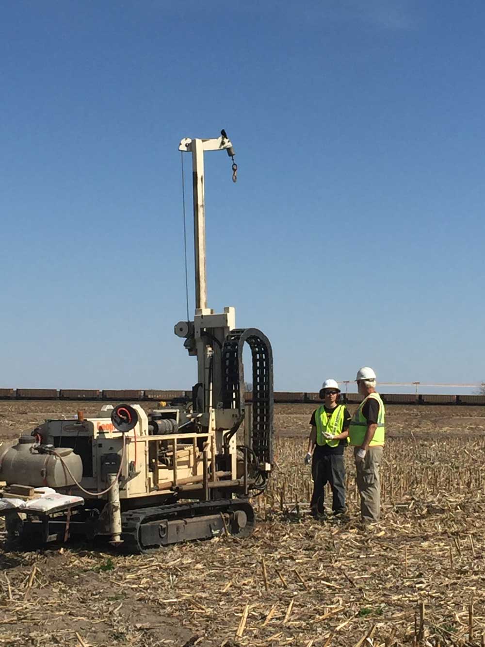 Track unit taking samples in a corn field.